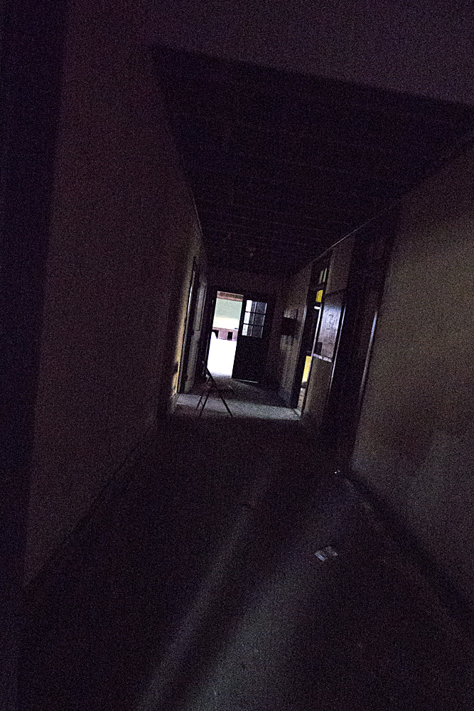 Dark Hallway with a Folding Chair