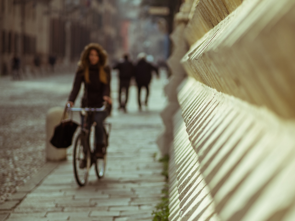 Palazzo dei Diamanti with Biker, Ferrara, Italy